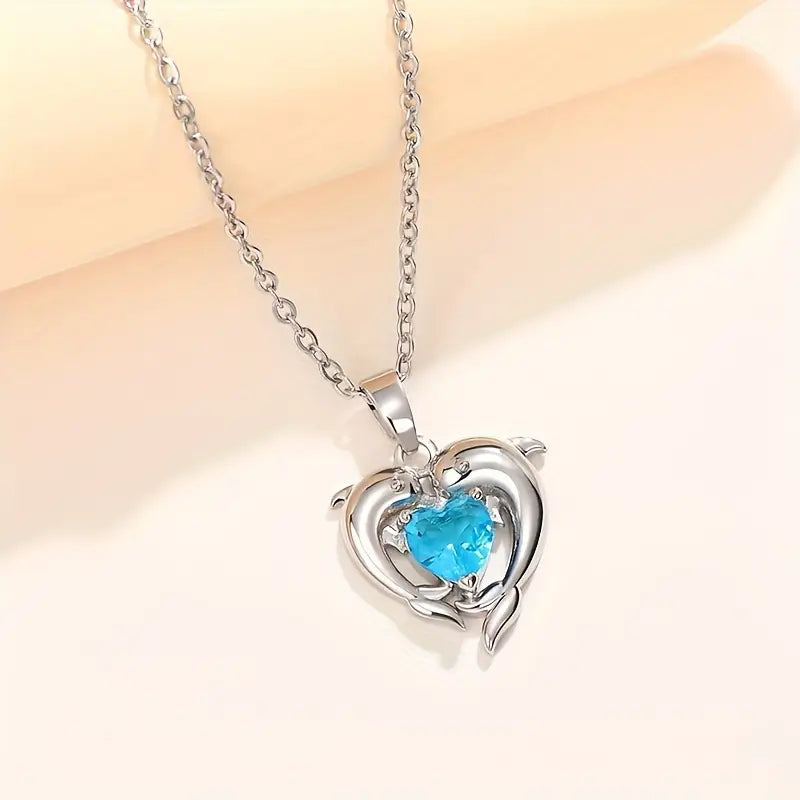 Amira – Heart-shaped pendant with sapphire.