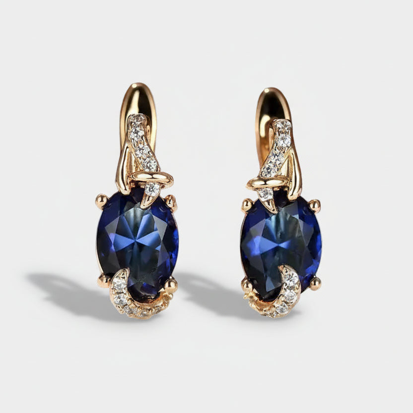 Elina – Earrings with a dark sapphire shine.