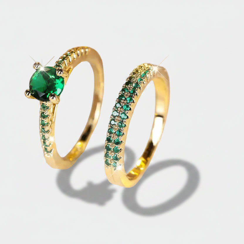 Victoria – Gold and emerald bracelets.