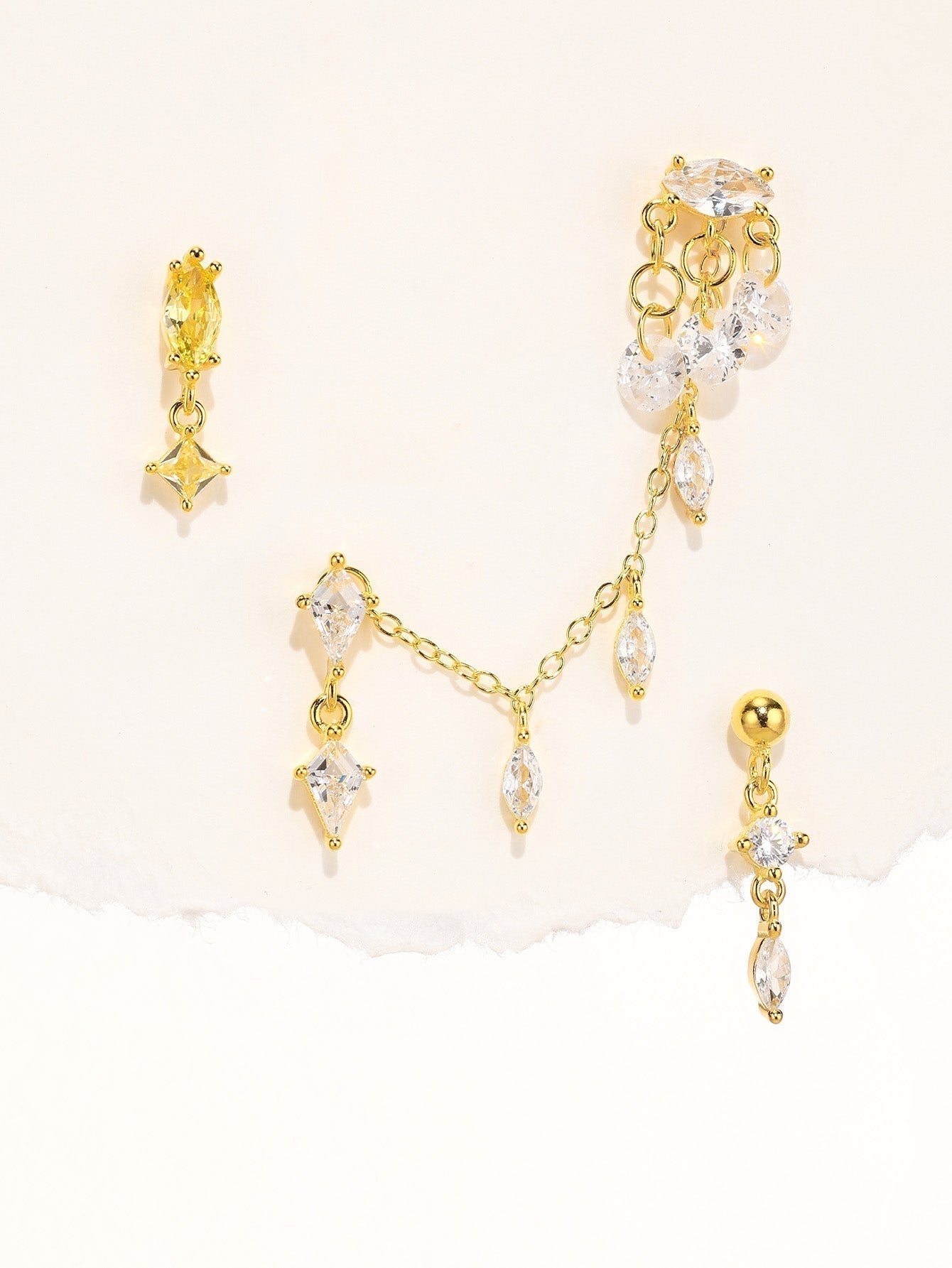 Elizabeth – Classically shaped gold earrings.