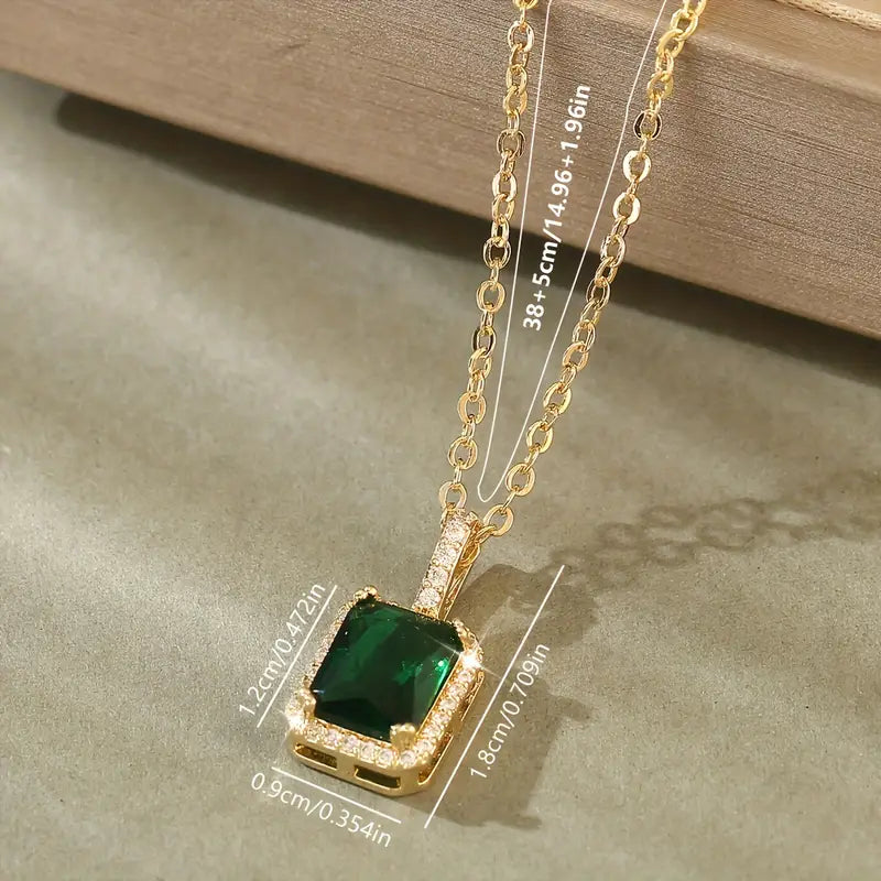 Miriam – Gold necklace with emerald pendant.