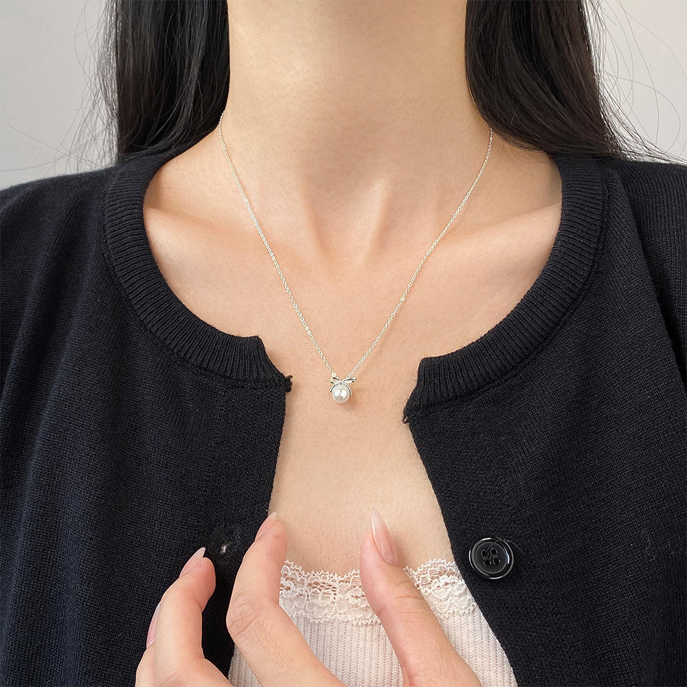 Johana-Luisa – Orecchini in oro con doppia perla.