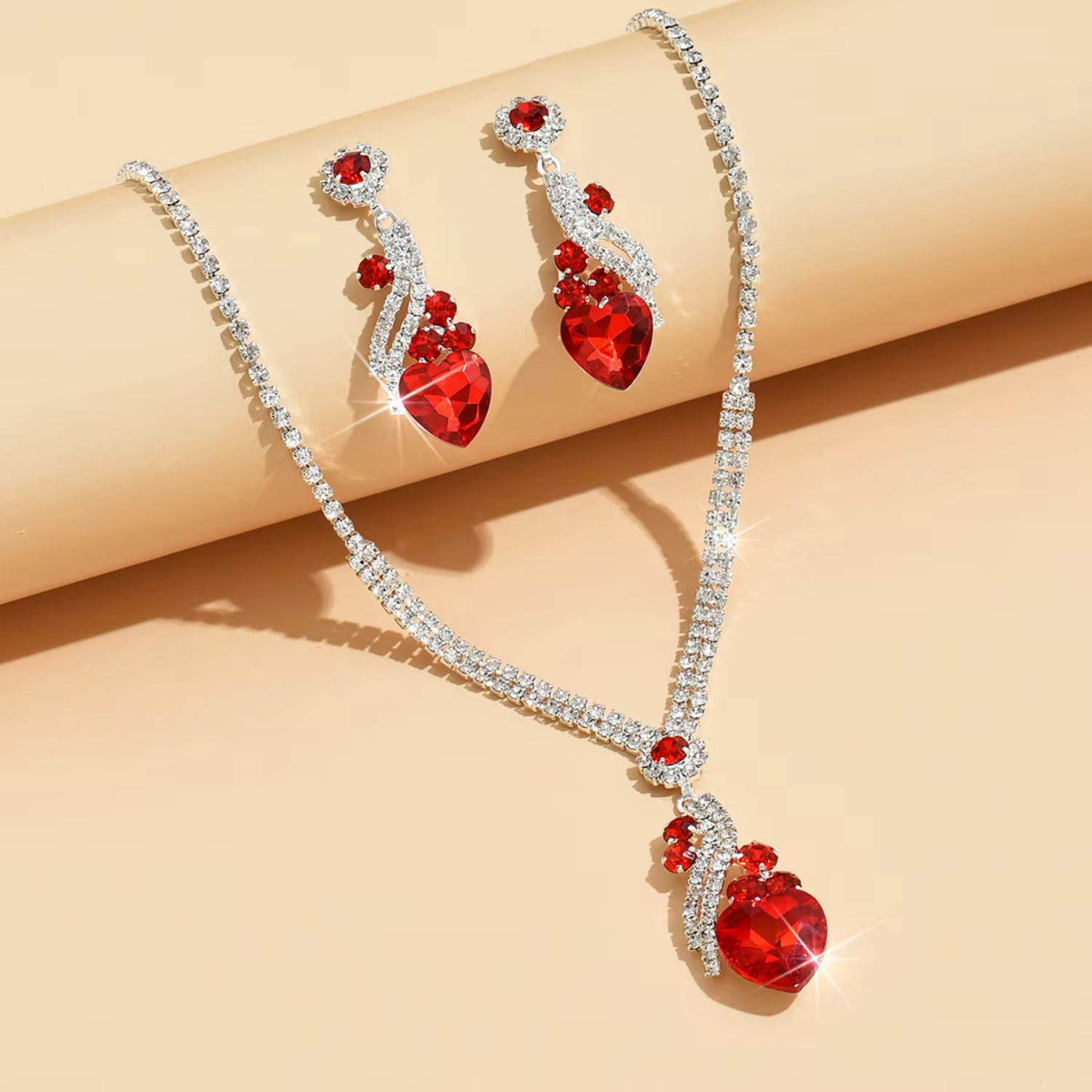 Ingrid – Set with rubies and golden highlights.