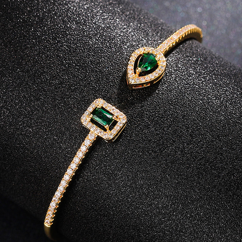 Klára – Open bracelet with emerald ends.