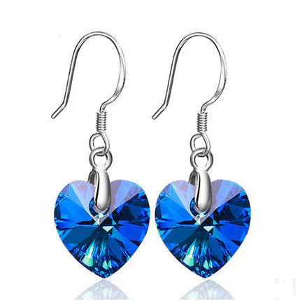 Elisa – Delicate earrings with sapphire accent.