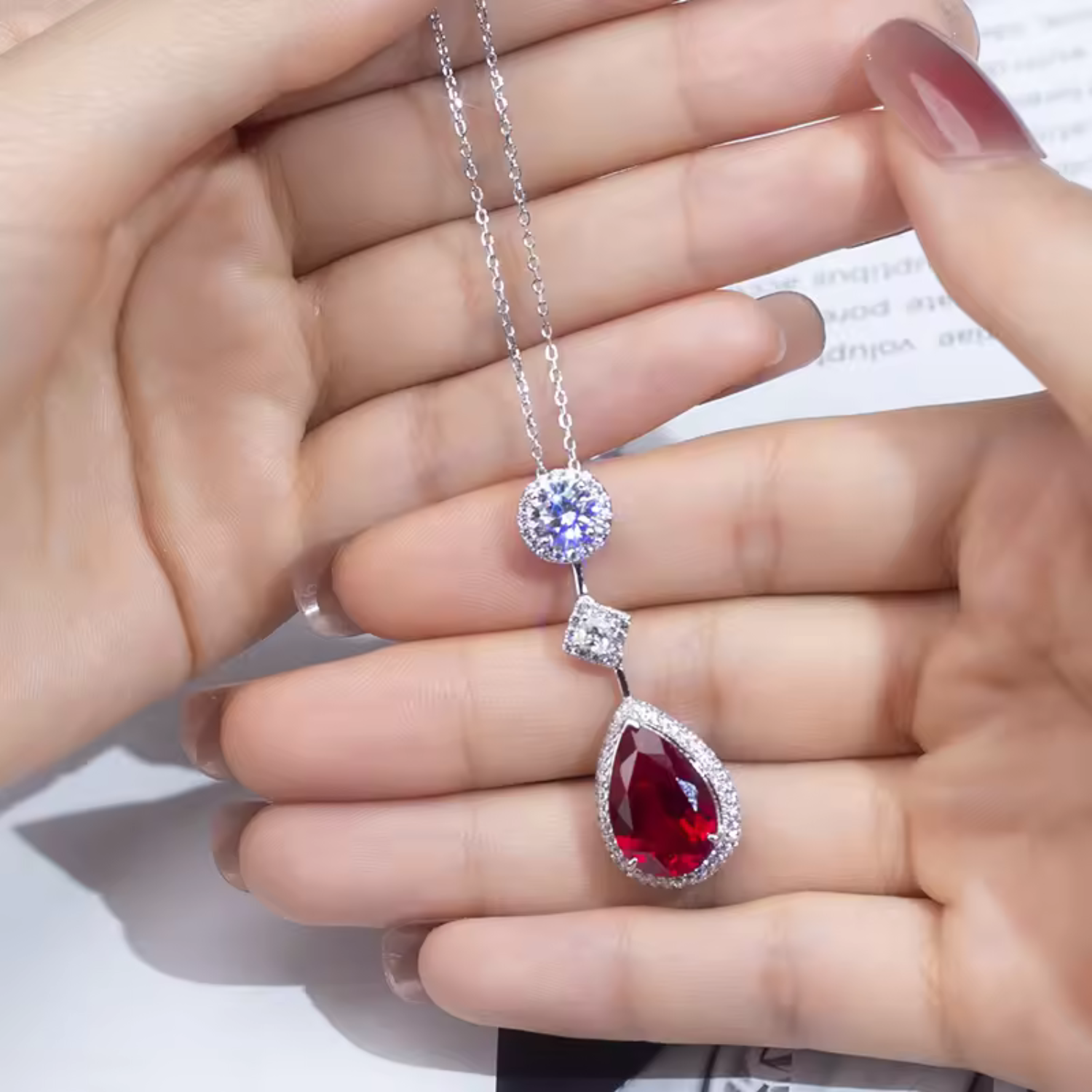 Pia – Pendant with ruby and delicate crystal setting.