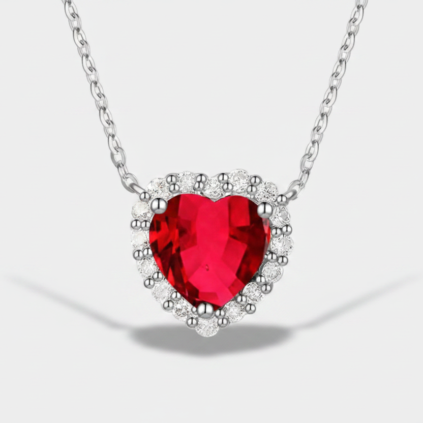 Romy – Silver necklace with ruby heart.