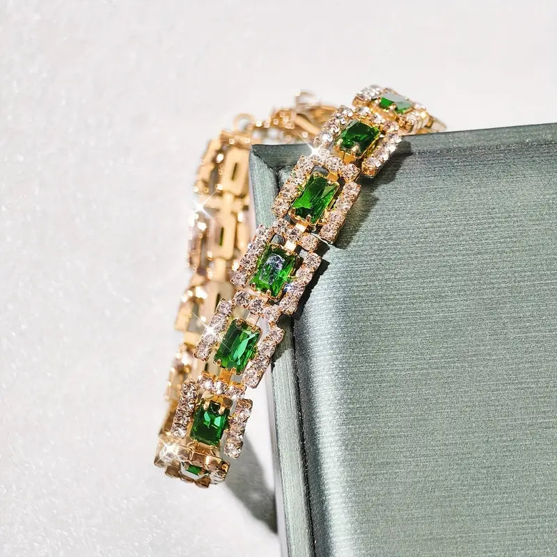 Josefína – Gold bracelet with rectangular emeralds.