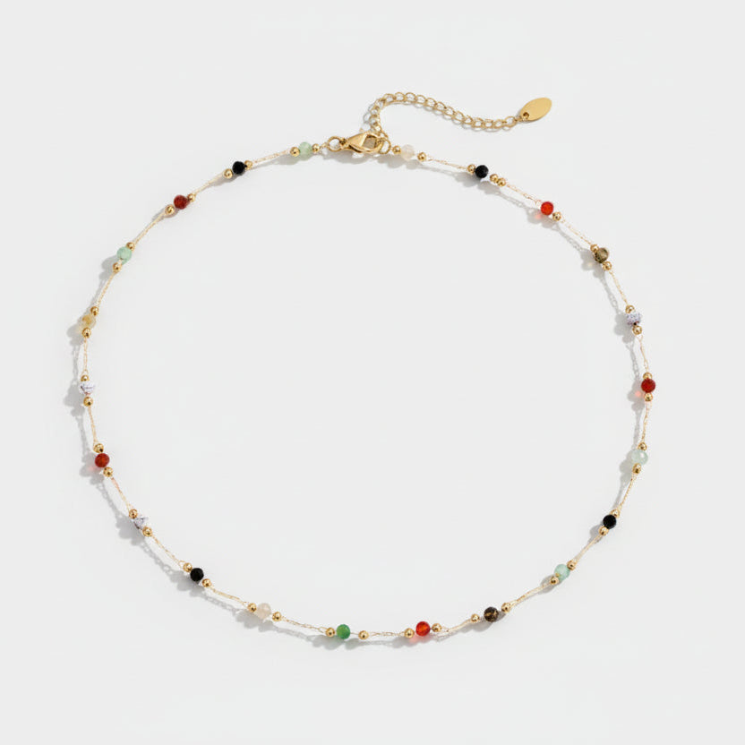 Helmina – Gold-colored chain with enamel details.