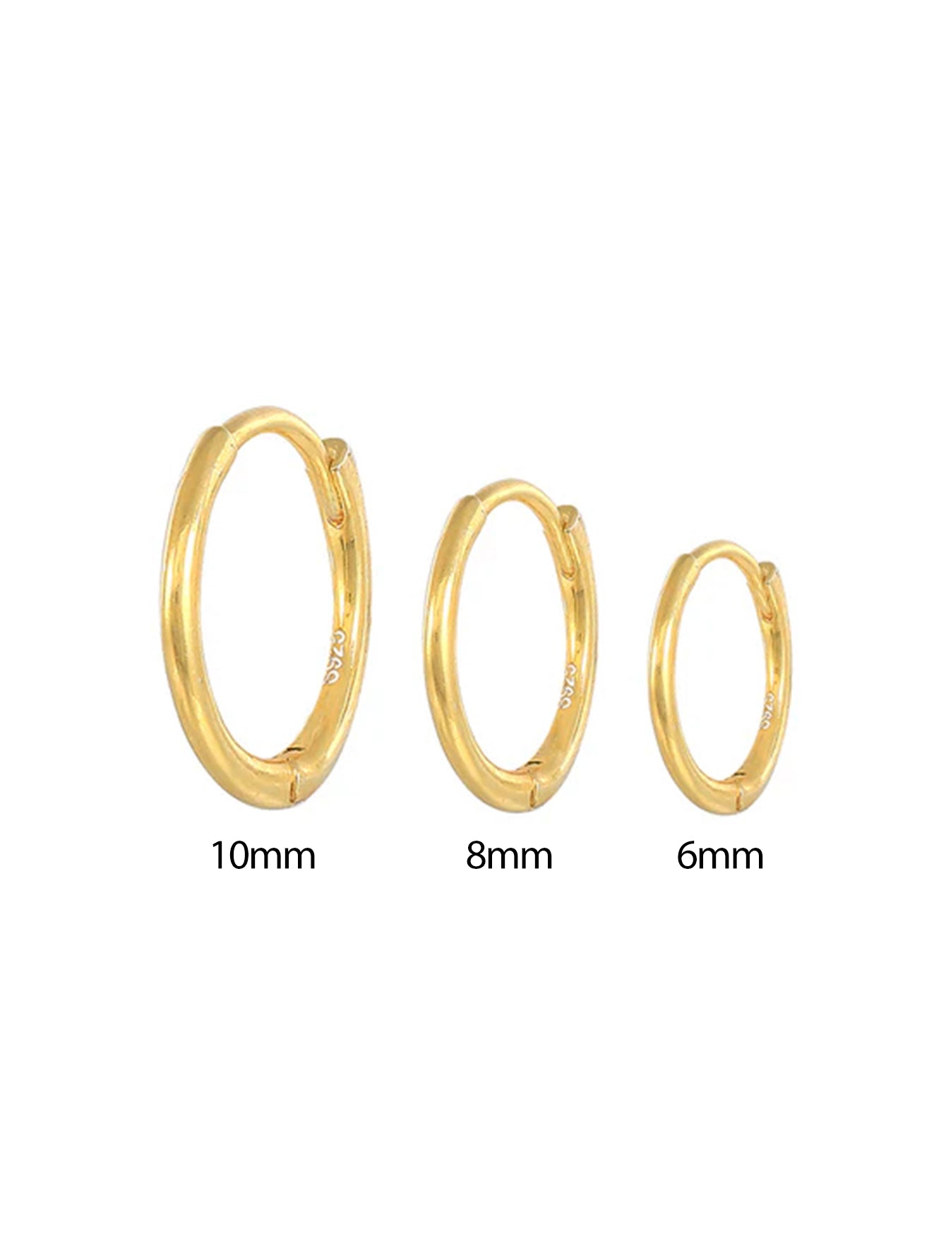 Emilie – Delicate gold earrings with a soft shine.