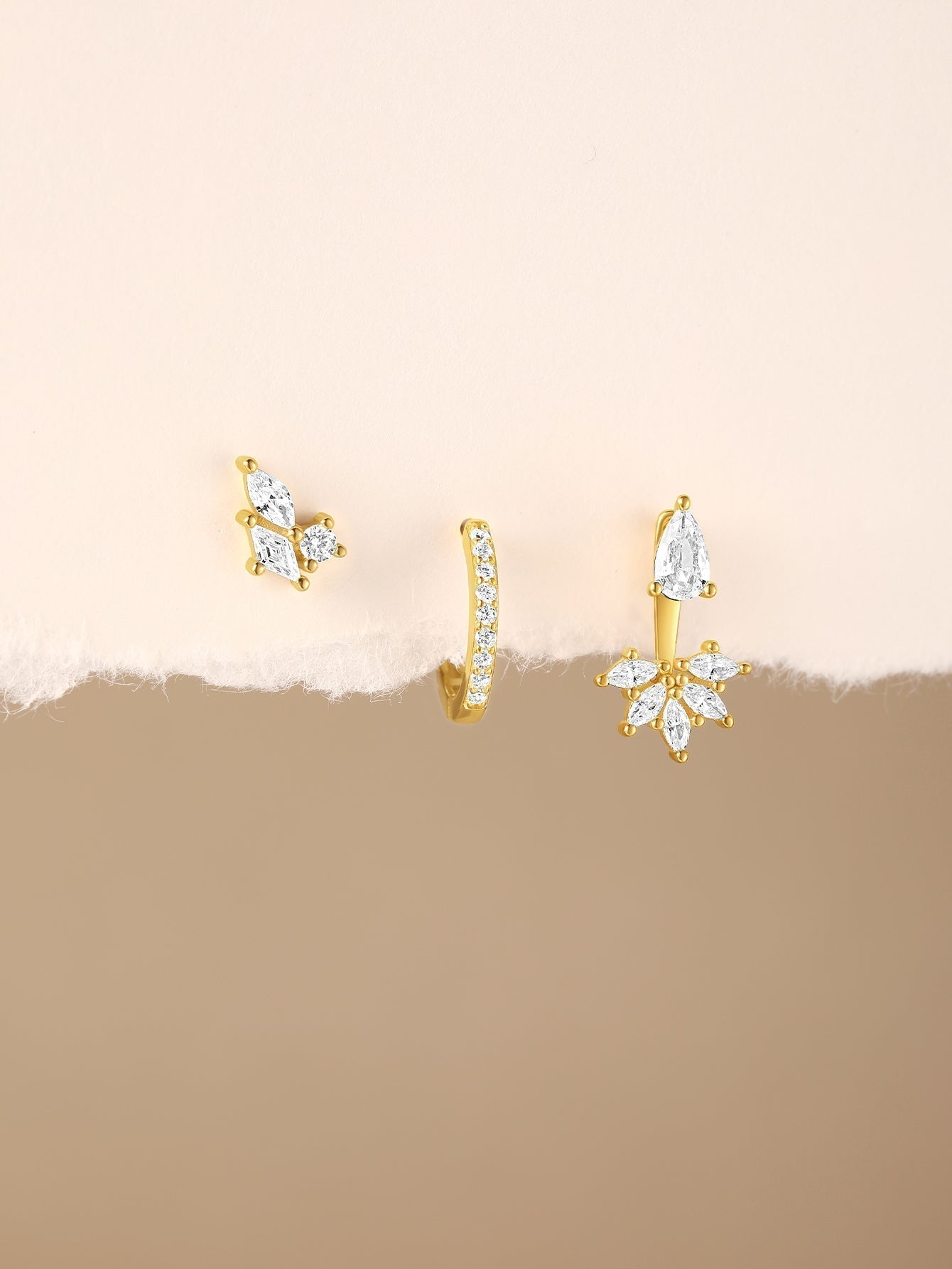 Magda – Delicate gold earrings with a soft sheen.