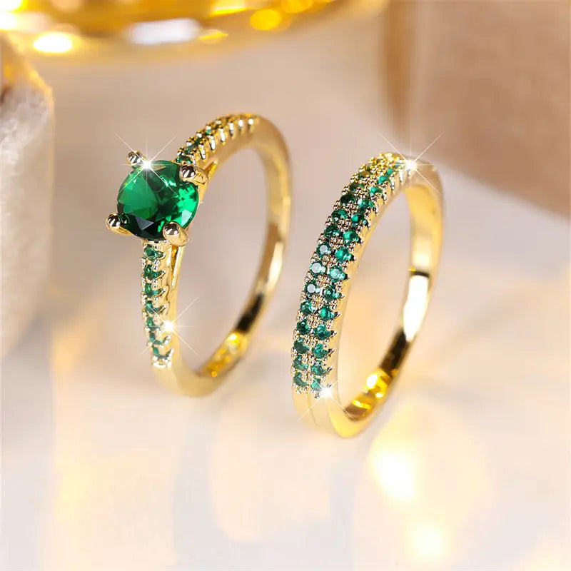 Victoria – Gold and emerald bracelets.
