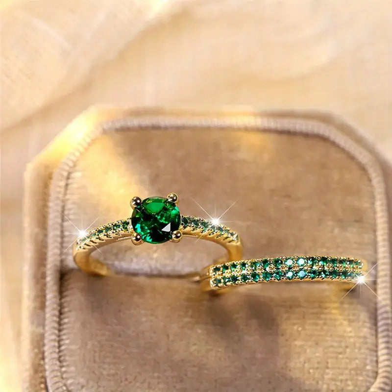 Victoria – Gold and emerald bracelets.