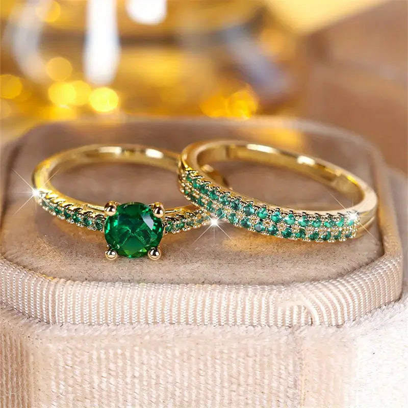 Victoria – Gold and emerald bracelets.