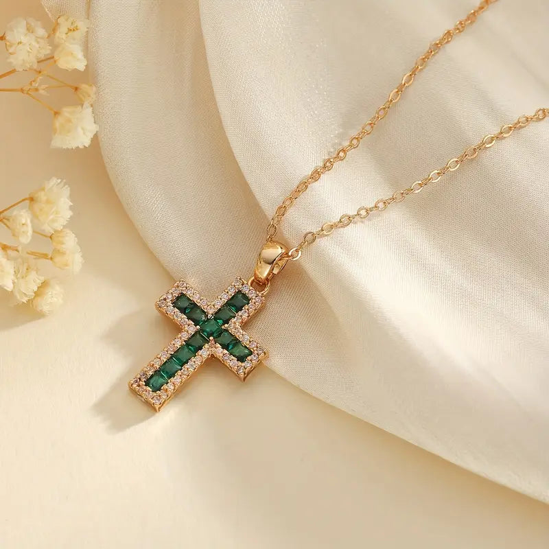 Alena – Cross pendant with emeralds.