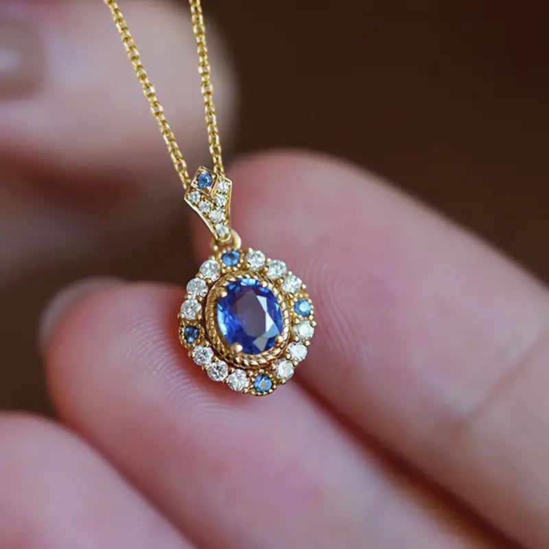 Larisa – Ring with gold and sapphire setting.