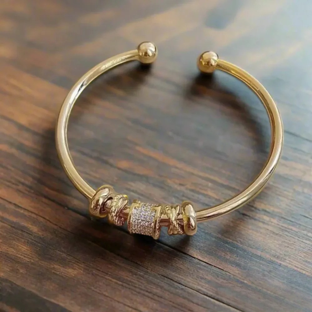 Adjustable gold bracelets with charms