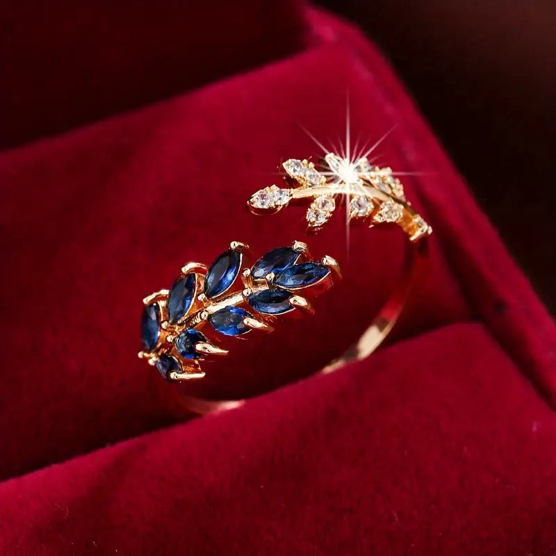 Aurelie - Red gold ring with blue stone.