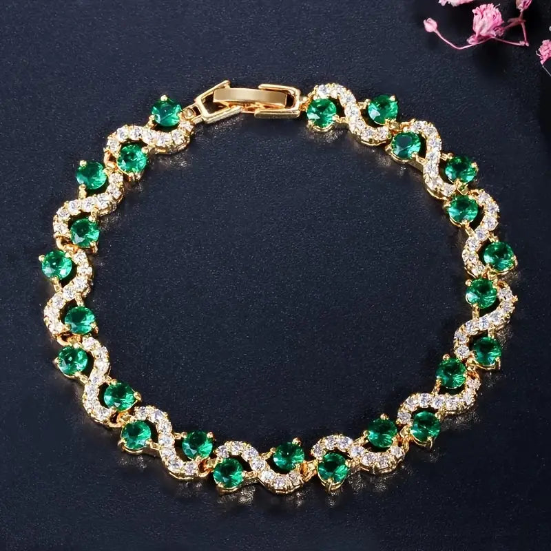 Celina – Emerald wristwatch with gold details.