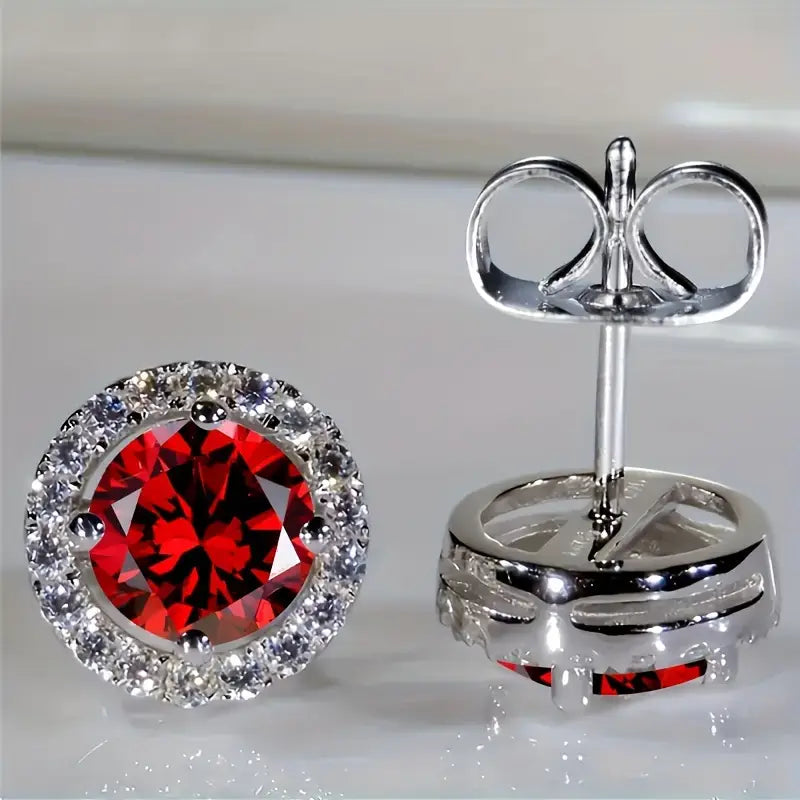 Luisa – Ruby earrings with sun motif.