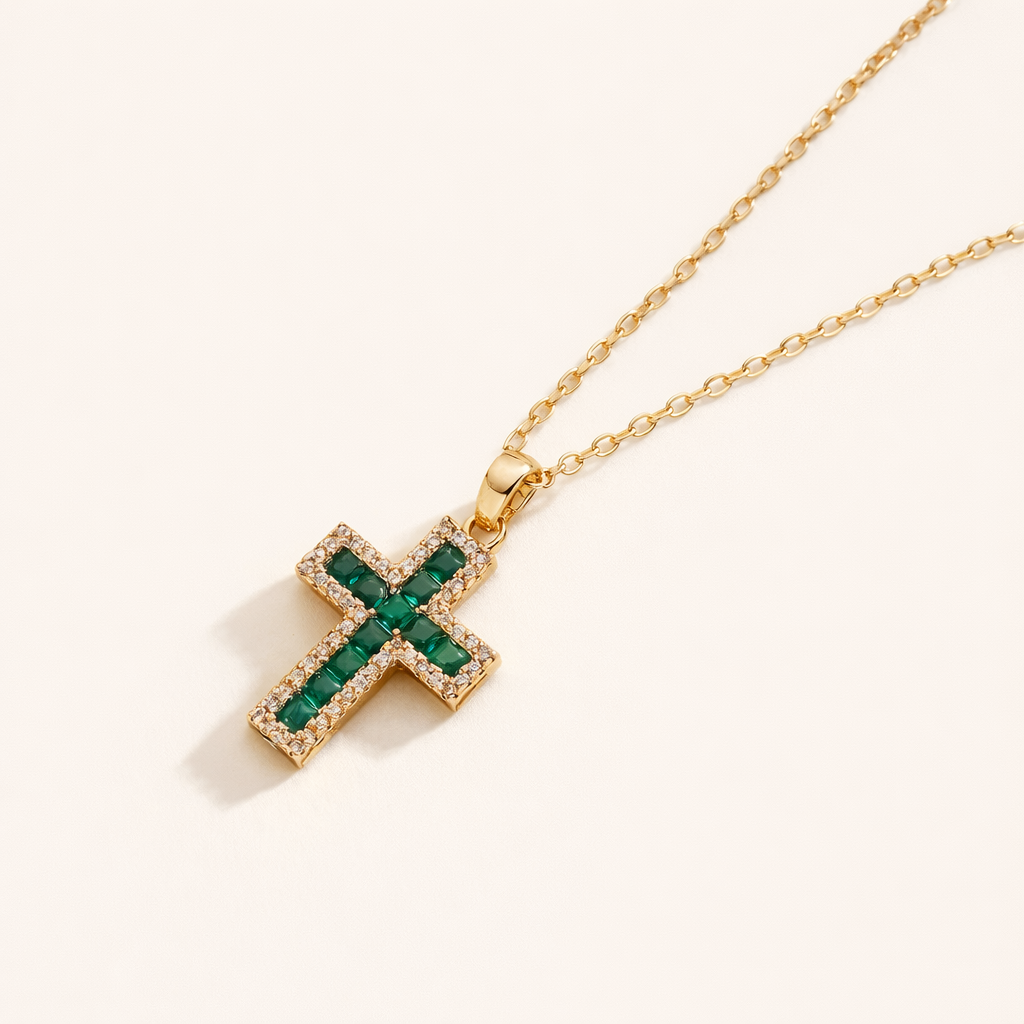 Alena – Cross pendant with emeralds.