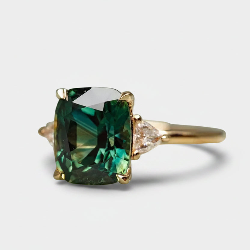 Emilie – Cushion-cut emerald ring.