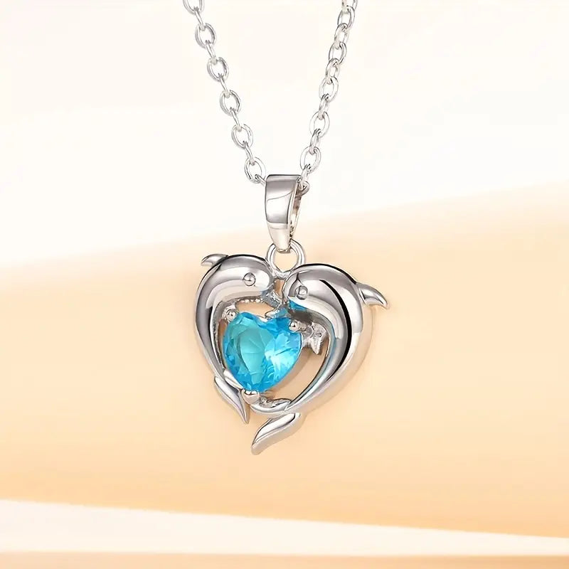 Amira – Heart-shaped pendant with sapphire.