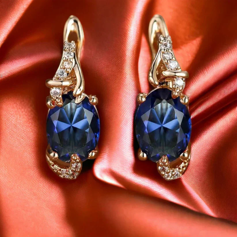 Elina – Earrings with a dark sapphire shine.