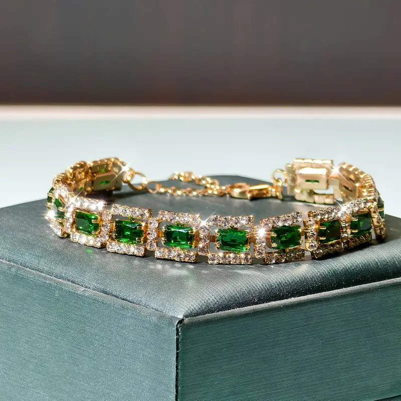 Josefína – Gold bracelet with rectangular emeralds.