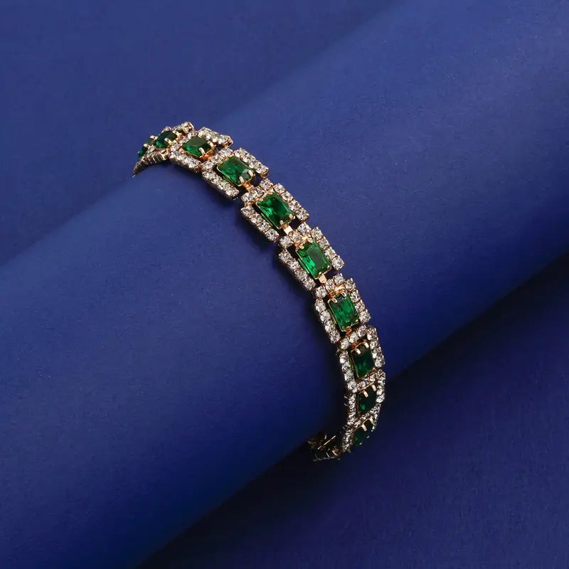 Josefína – Gold bracelet with rectangular emeralds.