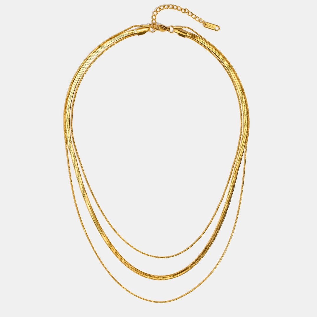 Antonie – Multilayer gold necklace with a transparent structure.