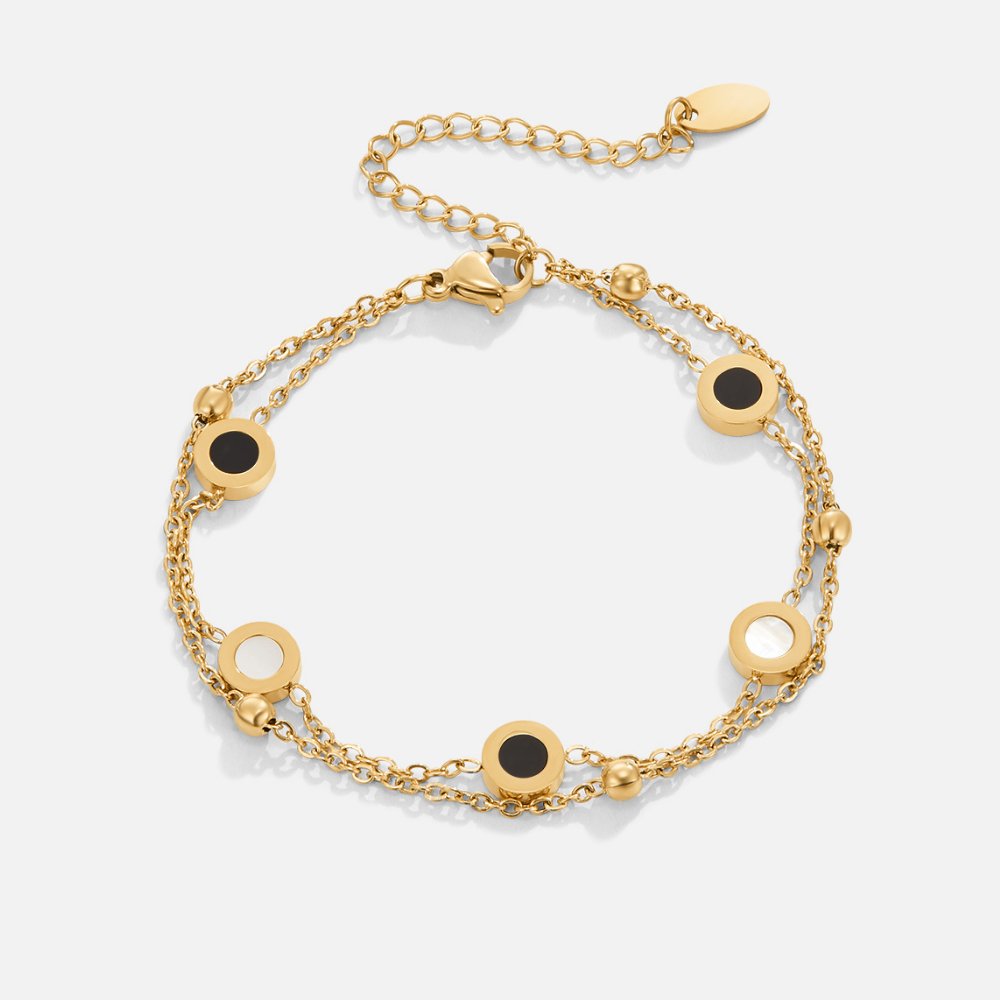 Carla – Delicate gold bracelet with contrasting round elements.
