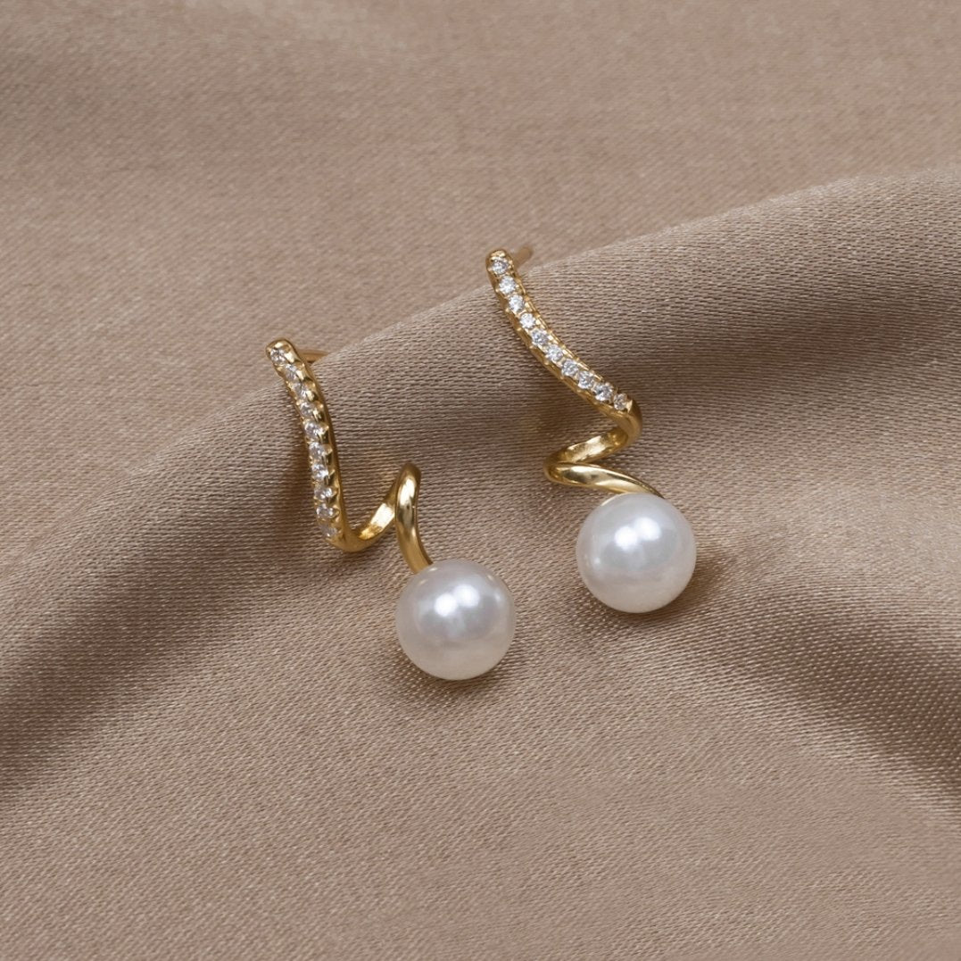 Silver earrings with a transparent drop structure.